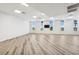 Bright, spacious flex room with wood floors, natural light, and modern fixtures at 516 Tamiami S Trl # 102, Nokomis, FL 34275