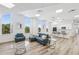 Spacious living area with large windows, a modern kitchen, and comfortable seating arrangements at 516 Tamiami S Trl # 102, Nokomis, FL 34275