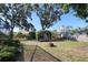Expansive backyard featuring mature trees and serene seating area, perfect for relaxation at 5340 Dominica Cir, Sarasota, FL 34233
