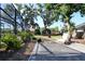 Spacious backyard with patio, lush trees, and a cozy seating area for outdoor enjoyment at 5340 Dominica Cir, Sarasota, FL 34233