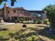 Large backyard featuring a screened-in pool and patio with manicured landscaping at 5340 Dominica Cir, Sarasota, FL 34233