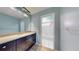 Updated bathroom features modern vanity with granite counters and a shower-tub combination at 5340 Dominica Cir, Sarasota, FL 34233