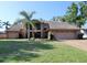 Charming two-story home with a well-manicured lawn, mature landscaping, and a spacious driveway at 5340 Dominica Cir, Sarasota, FL 34233