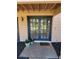 Welcoming entrance with double glass doors, a charming 'hello' mat, and potted plants at 5340 Dominica Cir, Sarasota, FL 34233