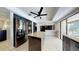 Contemporary kitchen with stainless steel refrigerator and center island for extra prep space at 5340 Dominica Cir, Sarasota, FL 34233