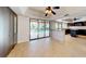 Living area with a view of the kitchen island, open floorplan, and backyard pool at 5340 Dominica Cir, Sarasota, FL 34233