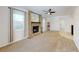 Comfortable living room featuring brick fireplace and ample natural light at 5340 Dominica Cir, Sarasota, FL 34233