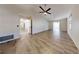 Spacious living room with vaulted ceiling, ceiling fan, and wood flooring at 5340 Dominica Cir, Sarasota, FL 34233