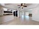 Bright, open-concept living area with wood floors and stylish ceiling fans at 5340 Dominica Cir, Sarasota, FL 34233