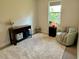 A welcoming bedroom with plush rug, a light-filled window, and comfortable seating at 5473 Gagnon Ter, North Port, FL 34291