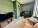 Comfortable living room space features an entertainment center, large-screen TV, and comfortable sofa at 5473 Gagnon Ter, North Port, FL 34291