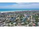 Aerial view of a charming waterfront neighborhood with quick access to a nearby beach at 5502 Shadow Lawn Dr, Sarasota, FL 34242
