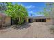 Spacious driveway leading to a unique home design with ample parking at 5502 Shadow Lawn Dr, Sarasota, FL 34242