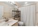 Clean bathroom with a shower, toilet, and vanity featuring a marble countertop at 5624 Ashton Lake Dr # 5624, Sarasota, FL 34231