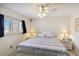Cozy bedroom with a ceiling fan, side tables, and a window, creating a peaceful retreat at 5624 Ashton Lake Dr # 5624, Sarasota, FL 34231