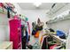 Spacious walk-in closet with shelving on multiple walls and hanging clothes at 5624 Ashton Lake Dr # 5624, Sarasota, FL 34231