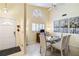 Dining area featuring a glass table, neutral decor, and tile floors at 5624 Ashton Lake Dr # 5624, Sarasota, FL 34231