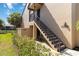Close up of exterior condo building, stairs, and landscaping at 5624 Ashton Lake Dr # 5624, Sarasota, FL 34231