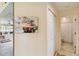 Hallway with a closet and bath, adjacent to living space with a wall art piece at 5624 Ashton Lake Dr # 5624, Sarasota, FL 34231