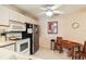 Compact kitchen featuring a full-sized refrigerator and gas range at 5624 Ashton Lake Dr # 5624, Sarasota, FL 34231