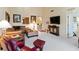 Spacious living room with high ceilings, neutral decor, and open layout at 5624 Ashton Lake Dr # 5624, Sarasota, FL 34231