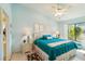 Inviting main bedroom boasts a plush bed, two bedside tables with lamps, soft carpet, and ample natural light at 5624 Ashton Lake Dr # 5624, Sarasota, FL 34231