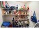 A full pantry with four shelves stacked high with various boxes, cans, bags, and containers at 5624 Ashton Lake Dr # 5624, Sarasota, FL 34231