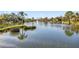 Scenic pond with fountains and lush landscaping, enhancing the community's natural beauty at 5624 Ashton Lake Dr # 5624, Sarasota, FL 34231