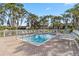 Inviting pool surrounded by lush palm trees and comfortable lounge chairs, perfect for relaxation at 5624 Ashton Lake Dr # 5624, Sarasota, FL 34231