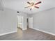 Well-lit bedroom with hard surface floors offers a view of a bathroom and closet area at 5691 Bentgrass Dr # 15-101, Sarasota, FL 34235