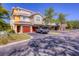 This is an exterior view of the units showing garages and landscaping at 5691 Bentgrass Dr # 15-101, Sarasota, FL 34235
