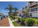 Luxury home featuring a beautiful pool, lounge chairs, and waterfront access at 581 Kingfisher Ln, Longboat Key, FL 34228