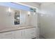 Bathroom featuring a modern vanity, bright lighting, and walk-in shower at 581 Kingfisher Ln, Longboat Key, FL 34228