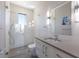 Modern bathroom with a walk-in glass shower and vanity sink at 581 Kingfisher Ln, Longboat Key, FL 34228