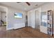 Bedroom area including a media center, closet, and doorways to other rooms at 581 Kingfisher Ln, Longboat Key, FL 34228