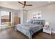 Comfortable bedroom featuring a ceiling fan, and views of the outdoor area at 581 Kingfisher Ln, Longboat Key, FL 34228