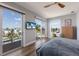 Bright bedroom with multiple sliding glass doors overlooking a waterfront view at 581 Kingfisher Ln, Longboat Key, FL 34228