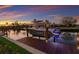 Waterfront property with boat lift and boat featuring a Yamaha motor on a peaceful canal at 581 Kingfisher Ln, Longboat Key, FL 34228