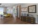 Bonus room with sliding barn doors, hardwood floors, and a cozy yellow couch, great for relaxation at 581 Kingfisher Ln, Longboat Key, FL 34228