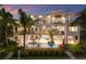 Beautiful multi-story home featuring waterfront views, balconies, and a private pool area at 581 Kingfisher Ln, Longboat Key, FL 34228