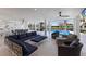 Spacious outdoor living area with comfortable seating and a view of the pool at 581 Kingfisher Ln, Longboat Key, FL 34228