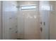 Elegant walk-in shower with rainfall showerhead and frameless glass door at 581 Kingfisher Ln, Longboat Key, FL 34228