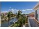 Scenic waterfront view from a deck featuring boat docks and lush landscaping at 581 Kingfisher Ln, Longboat Key, FL 34228