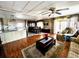 Cozy living room leading to an open kitchen and dining area, creating a connected and inviting space at 606 Cyprus Ct, Bradenton, FL 34207