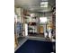 View of organized storage area featuring shelves, water heater, and ample space for storing household items at 606 Cyprus Ct, Bradenton, FL 34207