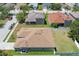 Aerial view of a home with a well-manicured lawn, a fenced backyard, and a brown shingle roof at 6106 34Th E Ct, Ellenton, FL 34222