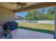 Covered patio overlooks a spacious, fenced backyard, perfect for outdoor entertaining and recreation at 6106 34Th E Ct, Ellenton, FL 34222