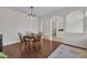 Inviting dining room with rich hardwood floors and stylish chandelier at 6106 34Th E Ct, Ellenton, FL 34222