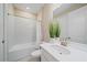 Bright bathroom featuring a white vanity, framed mirror, and shower over tub at 6120 Plateau Ct, Bradenton, FL 34203