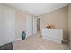 Neutral bedroom featuring carpet, a murphy bed, and access to additional rooms at 6120 Plateau Ct, Bradenton, FL 34203